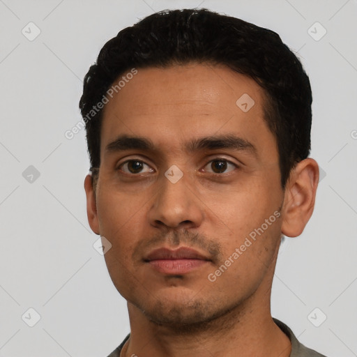 Neutral latino young-adult male with short  black hair and brown eyes