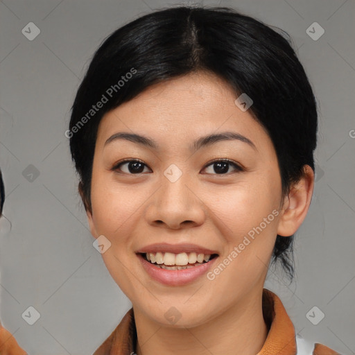 Joyful asian young-adult female with medium  black hair and brown eyes