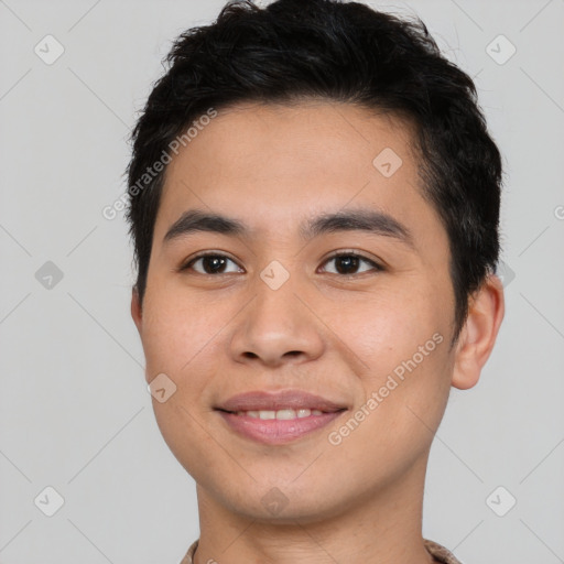 Joyful asian young-adult male with short  black hair and brown eyes