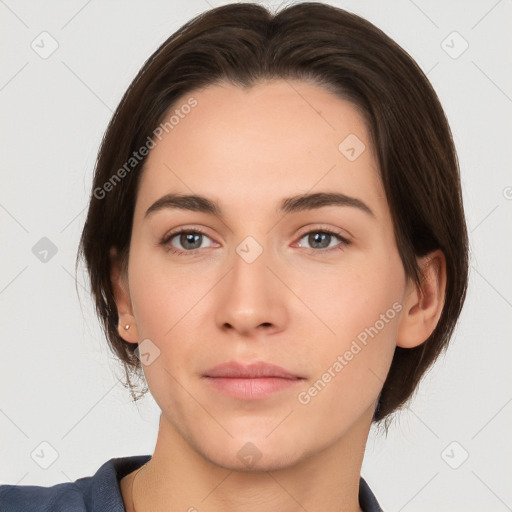 Neutral white young-adult female with short  brown hair and brown eyes