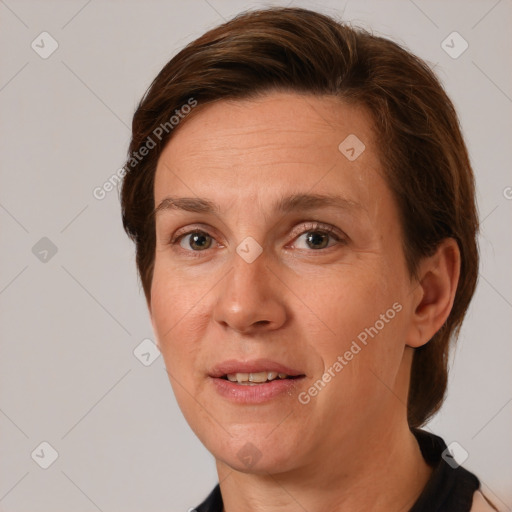 Joyful white adult female with short  brown hair and brown eyes