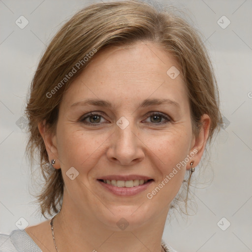 Joyful white adult female with medium  brown hair and brown eyes