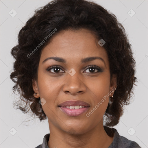 Joyful black young-adult female with medium  brown hair and brown eyes