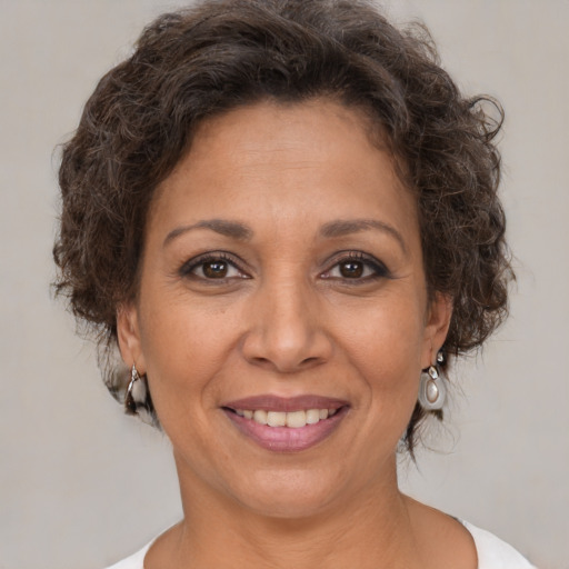 Joyful white adult female with short  brown hair and brown eyes