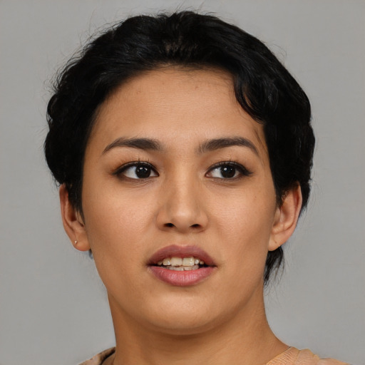 Joyful asian young-adult female with short  black hair and brown eyes