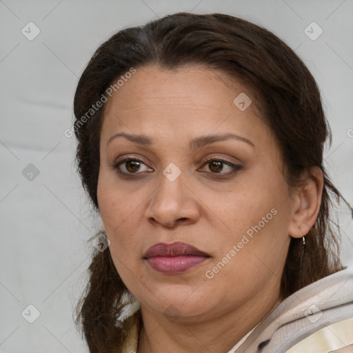Joyful white adult female with medium  brown hair and brown eyes