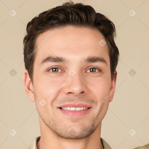 Joyful white young-adult male with short  brown hair and grey eyes