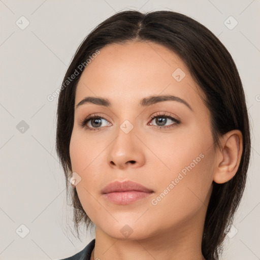 Neutral white young-adult female with long  brown hair and brown eyes