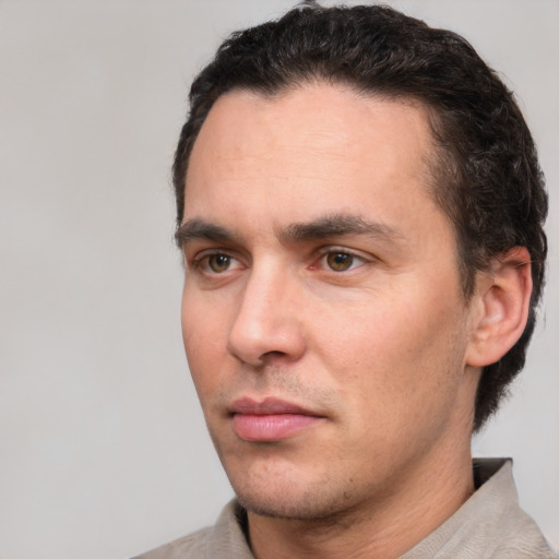 Neutral white young-adult male with short  black hair and brown eyes