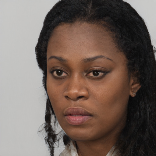 Neutral black young-adult female with long  black hair and brown eyes