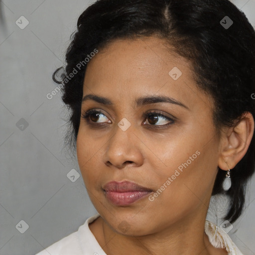 Joyful black young-adult female with medium  brown hair and brown eyes