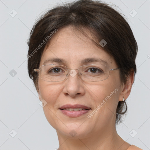 Joyful white adult female with medium  brown hair and brown eyes