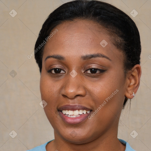 Joyful latino young-adult female with short  brown hair and brown eyes