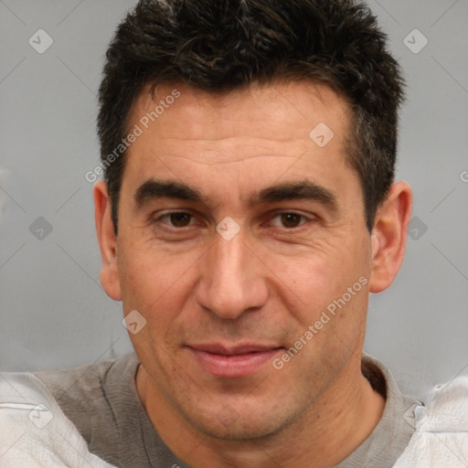 Joyful white adult male with short  brown hair and brown eyes