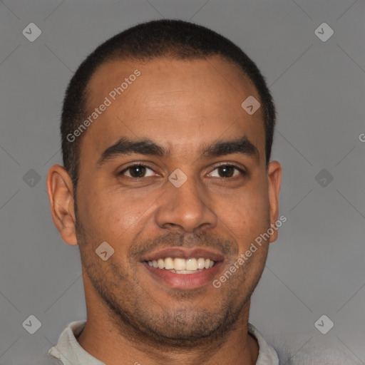 Joyful latino young-adult male with short  brown hair and brown eyes