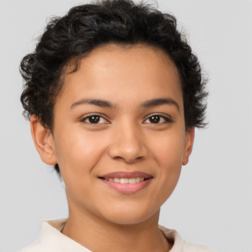 Joyful latino young-adult female with short  brown hair and brown eyes