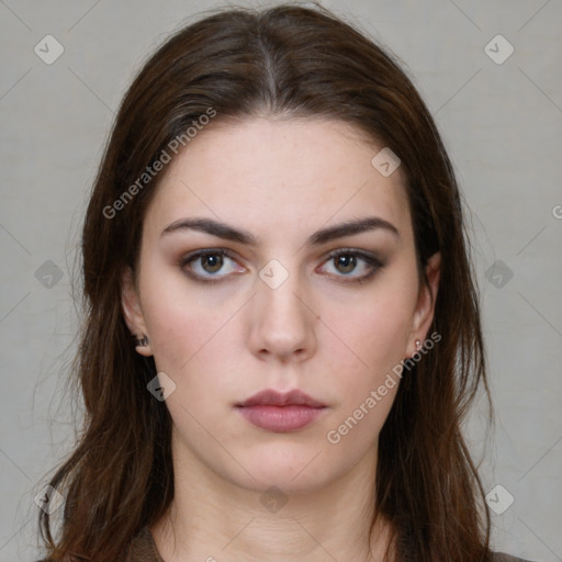 Neutral white young-adult female with long  brown hair and brown eyes