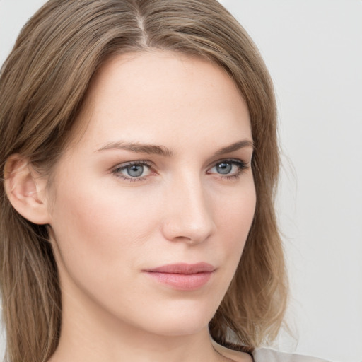 Neutral white young-adult female with long  brown hair and grey eyes