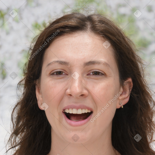 Joyful white adult female with long  brown hair and brown eyes