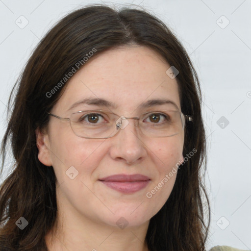 Joyful white adult female with long  brown hair and grey eyes