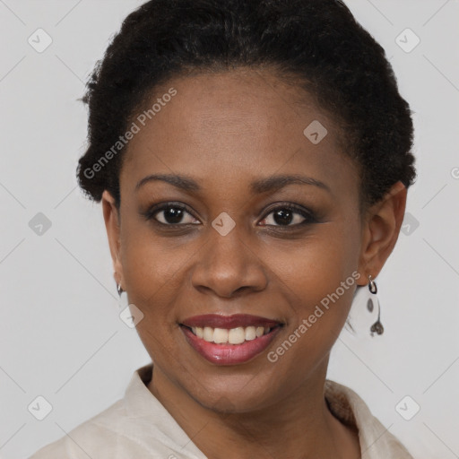 Joyful black young-adult female with short  brown hair and brown eyes