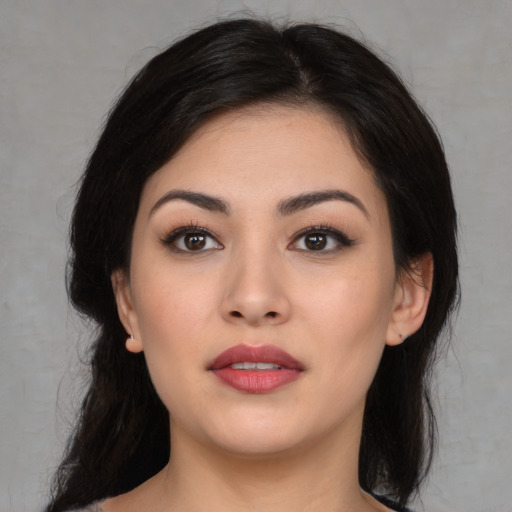 Joyful white young-adult female with medium  black hair and brown eyes