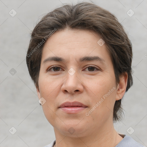 Joyful white adult female with short  brown hair and brown eyes