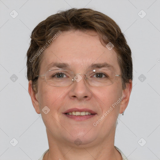 Joyful white adult female with short  brown hair and grey eyes