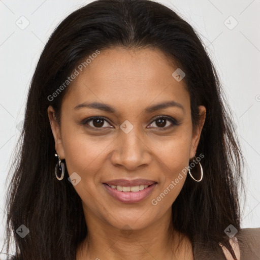 Joyful black young-adult female with long  brown hair and brown eyes