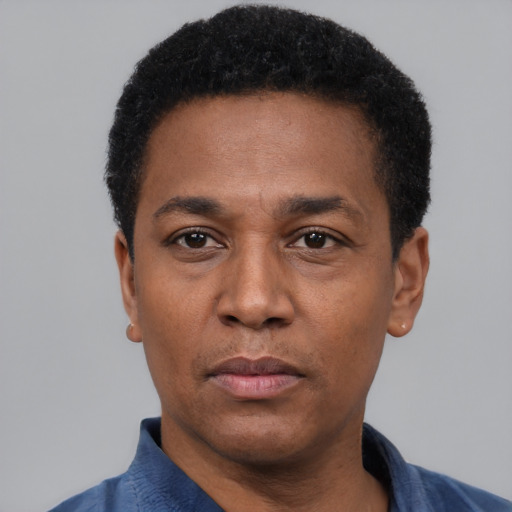 Neutral latino adult male with short  black hair and brown eyes