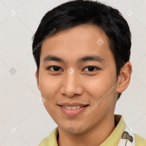 Joyful asian young-adult male with short  black hair and brown eyes