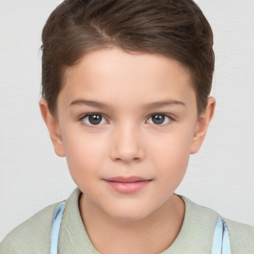 Joyful white child female with short  brown hair and brown eyes