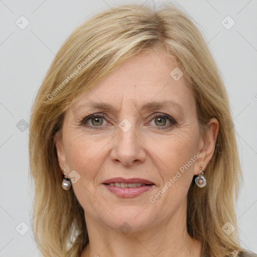 Joyful white adult female with long  brown hair and grey eyes