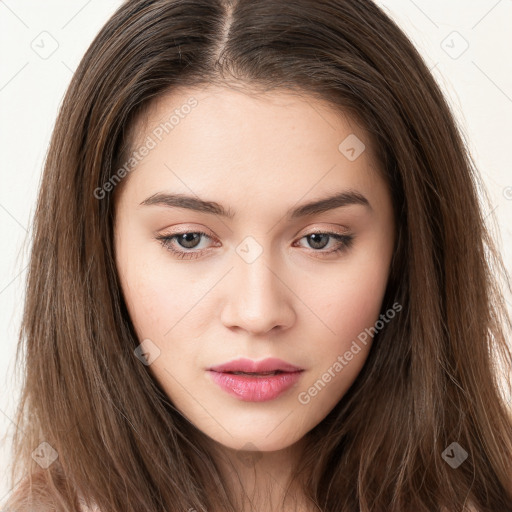 Neutral white young-adult female with long  brown hair and brown eyes