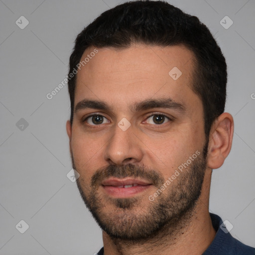 Joyful white young-adult male with short  black hair and brown eyes