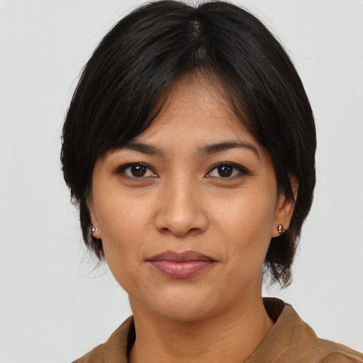 Joyful asian young-adult female with medium  black hair and brown eyes