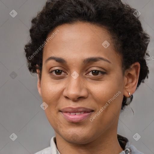 Joyful latino adult female with short  brown hair and brown eyes