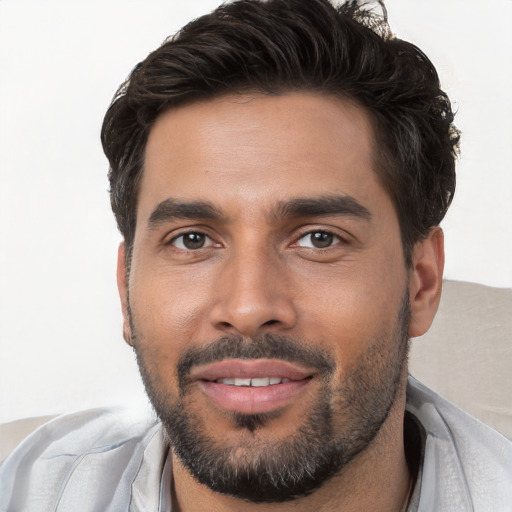 Joyful white young-adult male with short  black hair and brown eyes