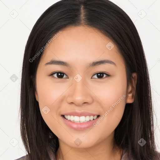 Joyful asian young-adult female with long  brown hair and brown eyes