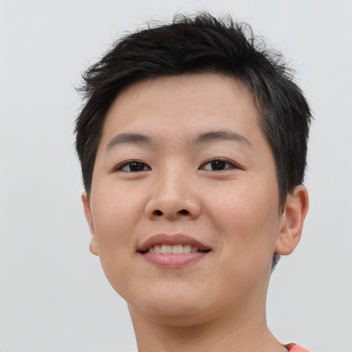 Joyful asian young-adult female with short  brown hair and brown eyes
