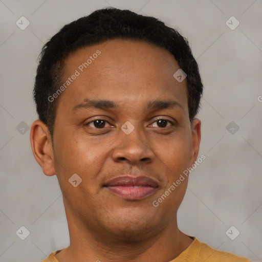 Joyful latino young-adult male with short  brown hair and brown eyes