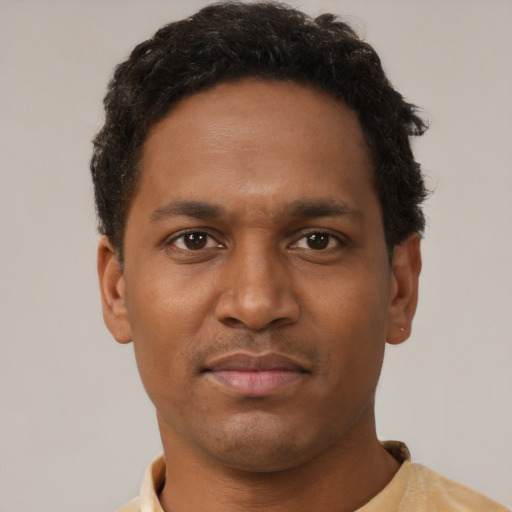 Neutral black young-adult male with short  black hair and brown eyes