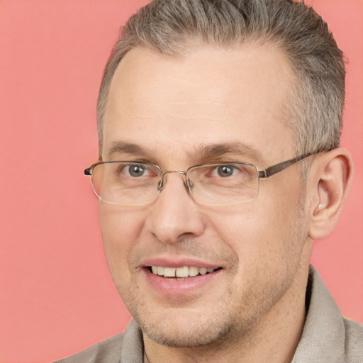 Joyful white adult male with short  brown hair and brown eyes