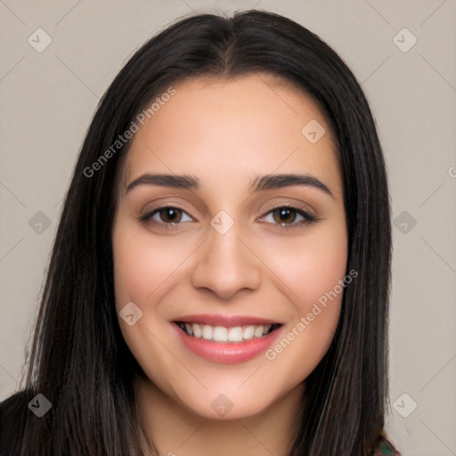 Joyful white young-adult female with long  black hair and brown eyes