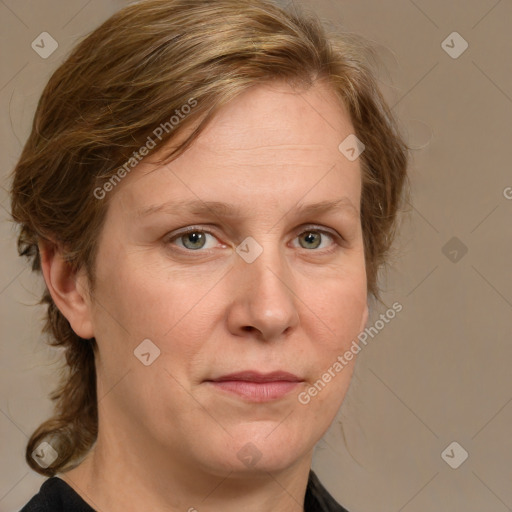 Joyful white adult female with medium  brown hair and blue eyes