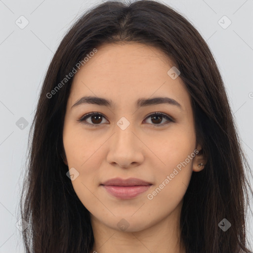 Joyful latino young-adult female with long  brown hair and brown eyes