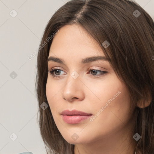 Neutral white young-adult female with long  brown hair and brown eyes