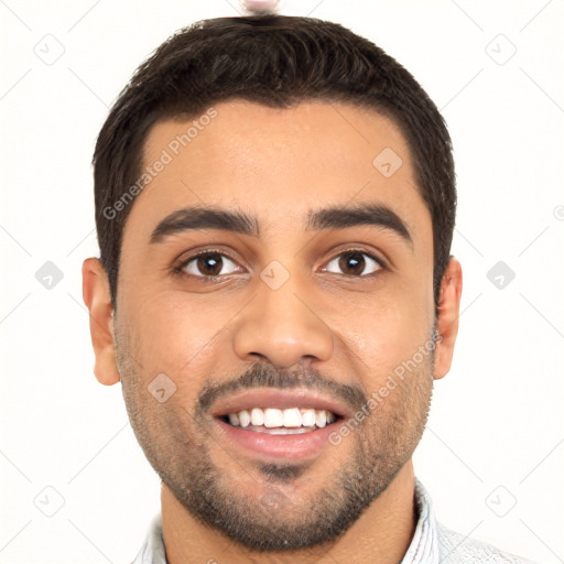 Joyful latino young-adult male with short  black hair and brown eyes