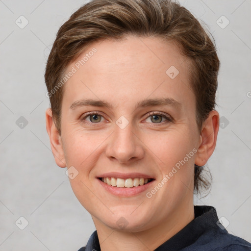 Joyful white young-adult female with short  brown hair and grey eyes