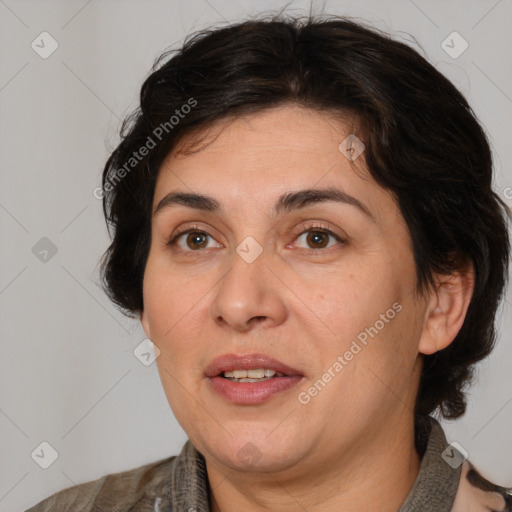 Joyful white adult female with medium  brown hair and brown eyes